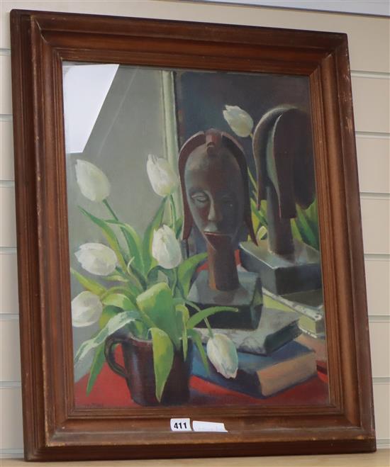 G.D. Watton, oil on canvas, Still life of an African mask and white tulips, signed, 52 x 42cm